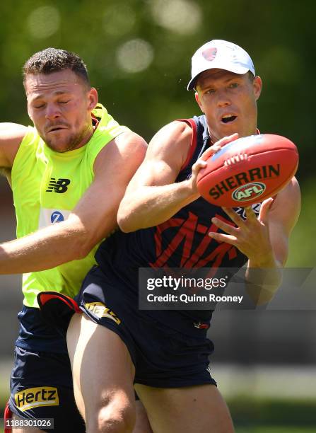 Jake Melksham of the Demons marks infront of Steven May of the Demons during a Melbourne Demons Training Session & Media Opportunity at Gosch's...