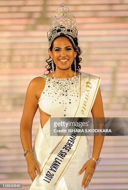 Sri Lankan beauty queen Stephanie Siriwardena smiles as she is crowned Miss Sri Lanka during a glittering contest in Colombo on July 11, 2011. The...