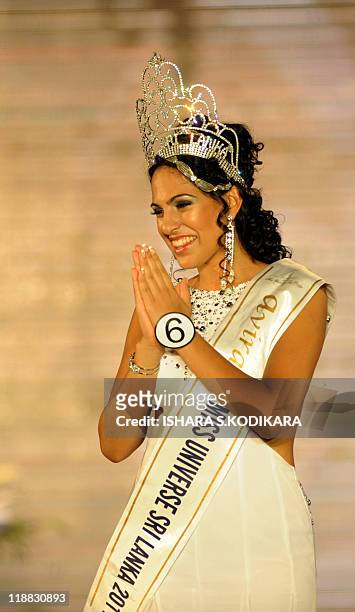 Sri Lankan beauty queen Stephanie Siriwardena reacts as she is crowned Miss Sri Lanka during a glittering contest in Colombo on July 11, 2011. The...
