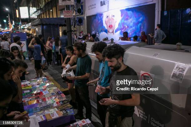 People select books in a stand of the Night of the Bookstores on November 17, 2019 in Buenos Aires, Argentina. Buenos Aires is the city with most...