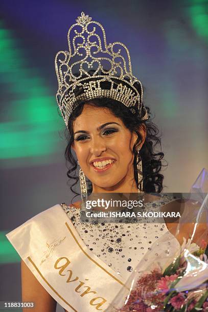 Sri Lankan beauty queen Stephanie Siriwardena reacts as she is crowned Miss Sri Lanka during a glittering contest in Colombo on July 11, 2011. The...