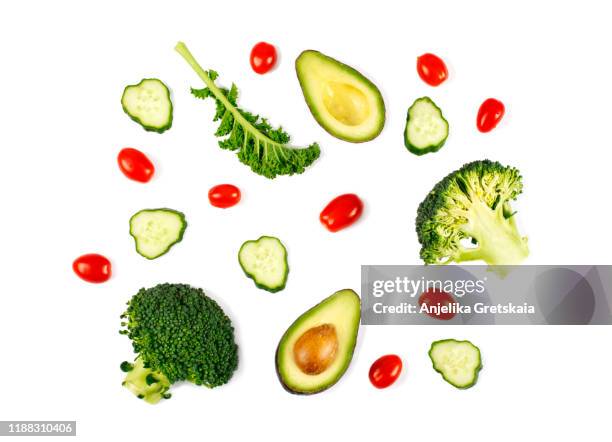 fresh green vegetables isolated on white background. flat lay. food concept - avocado isolated imagens e fotografias de stock