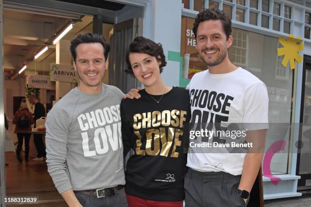 Andrew Scott, Phoebe Waller-Bridge and Ben Aldridge volunteer during Match Fund day at the 'Choose Love' shop for Help Refugees in Covent Garden on...