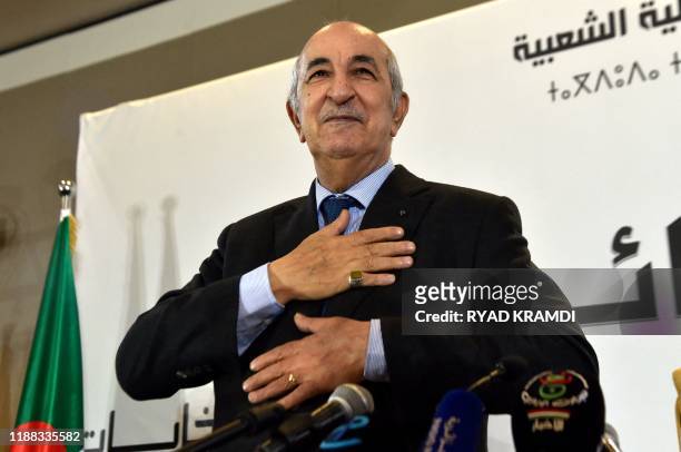 Algerian President-elect Abdelmadjid Tebboune greets attendees during a press conference in the capital Algiers, on December 13, 2019. - Abdelmadjid...