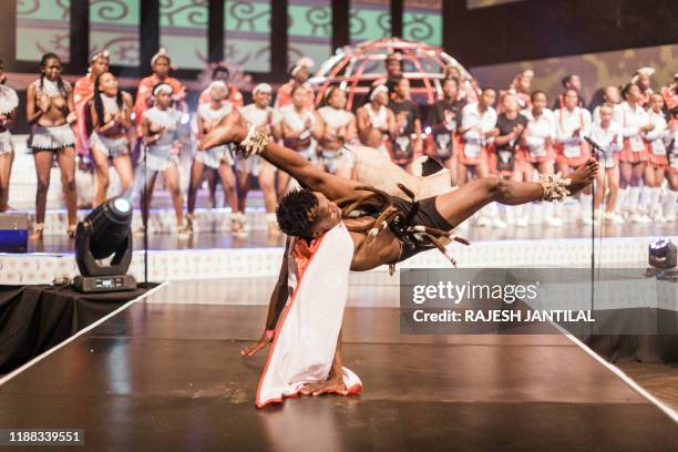 Participants dressed in traditional attire sing and dance on stage at the 3 day Indoni Cultural Festival on December 13 in Durban. The Indoni...