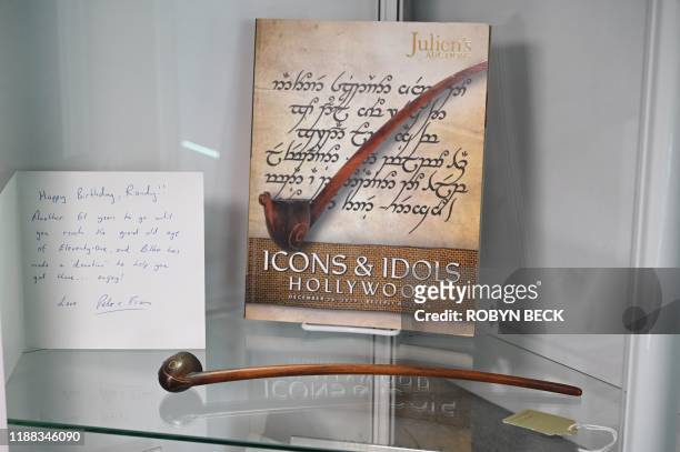 An original tobacco pipe used by actor Ian Holm as the hobbit Bilbo Baggins in the 2001 film "The Lord of the Rings: The Fellowship of the Ring" is...
