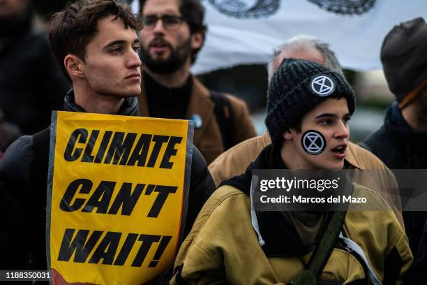 Activists protesting outside IFEMA, where UN Climate Change Conference COP25 is being held. Fridays for Future and Extinction Rebellion activists are...