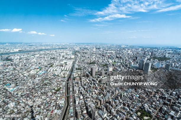 tokyo aerial panorama across skyscraper cityscape - urban sprawl stock pictures, royalty-free photos & images