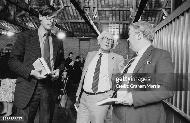 British journalist Max Hastings with British Labour Party politician Michael Foot at a book presentation event, UK, 5th June 1984.