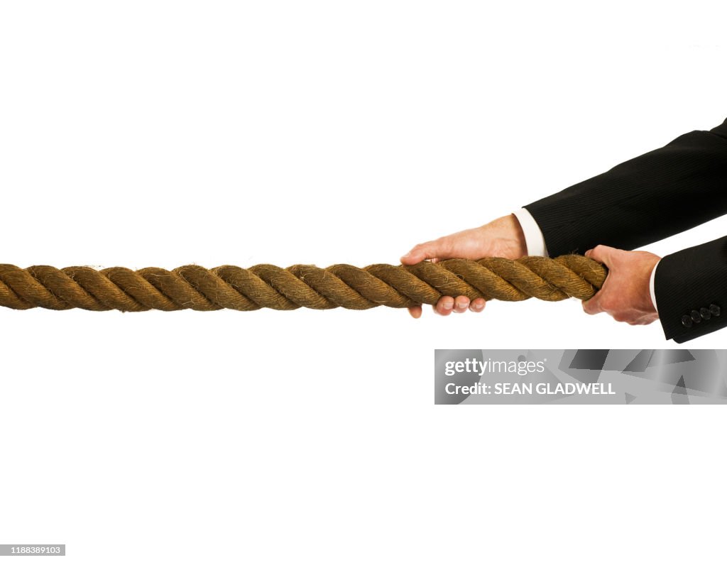 Pulling Rope Load Businessman Pulling Rope High-Res Stock Photo - Getty Images