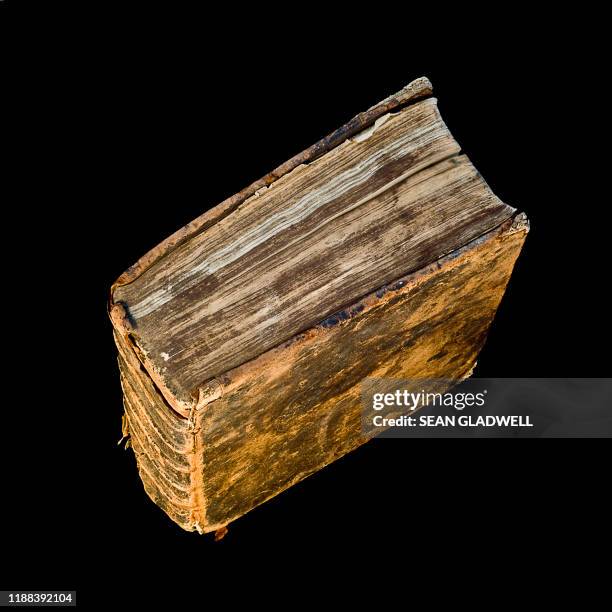 ragged old thick book - old book cover stock pictures, royalty-free photos & images