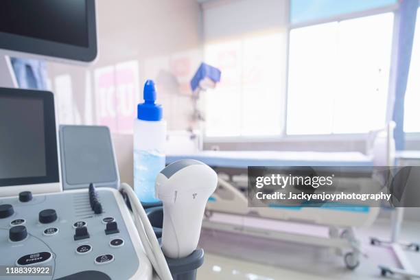 ultrasound probe examination in icu/emergency room - gynaecologist stock-fotos und bilder