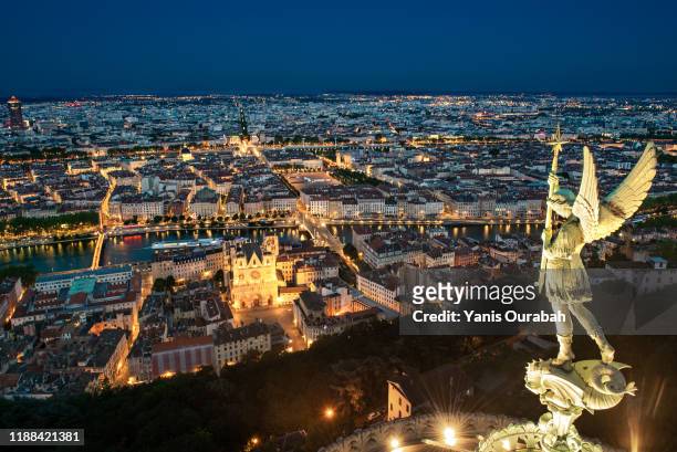 panorama of the city of lyon at night from the roof of the fourviere church - lyon france stock pictures, royalty-free photos & images