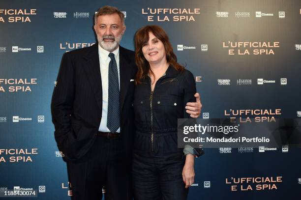 Italian actor Luca Barbareschi end French actress Emmanuelle Seigner during photocall for the presentation of the film L'ufficiale e la spia at...