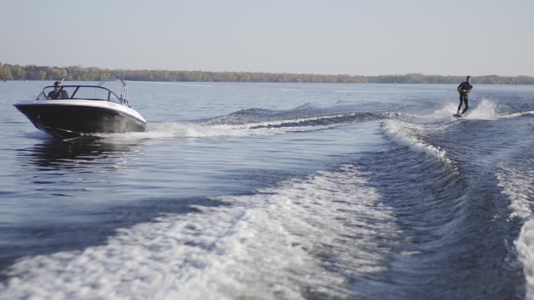 https://media.gettyimages.com/id/1188433600/video/young-man-wakeboarding-on-river.jpg?b=1&s=640x640&k=20&c=TPG2vhGQnqAmr50_VzLPHf9JYa9OppQsylW2rVhDAe8=
