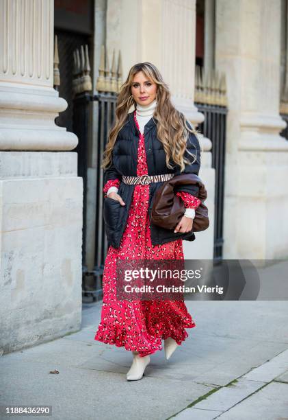 Ekaterina Mamaeva is seen wearing creme white boots The Row, red dress with floral print Munthe, belt with zebra animal print Loeffler Randall, brown...