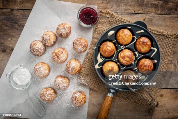 traditional apple pancakes or aebleskiver in danish. - breakfast pastries stock pictures, royalty-free photos & images