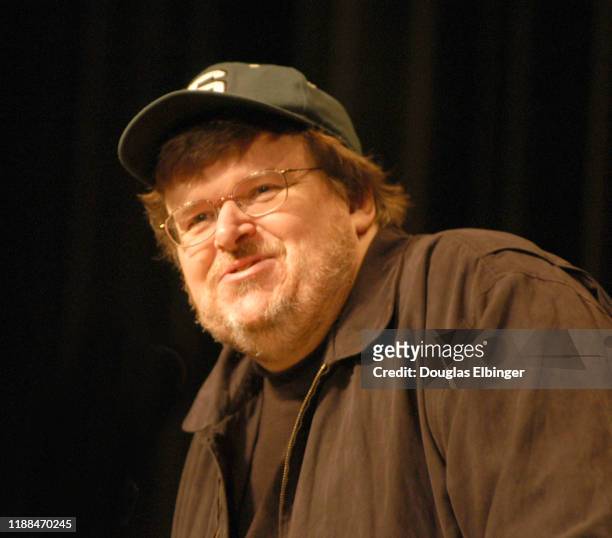 View of American documentary filmmaker, author, and political activist Michael Moore during an event at the Michigan State University Auditorium on...