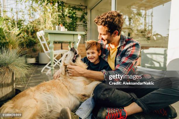 relaxing moments with our dog - family children dog stock pictures, royalty-free photos & images