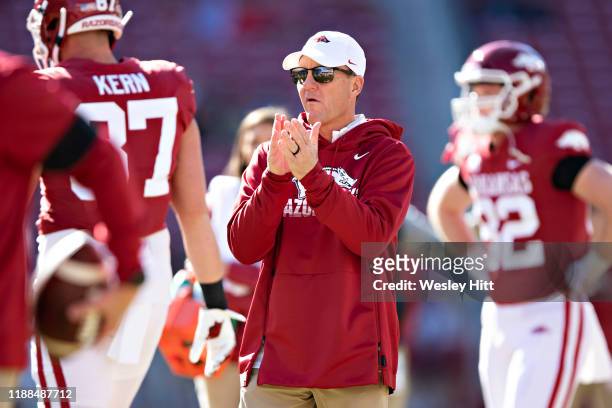 Head Coach Chad Morris of the Arkansas Razorbacks watches his team warm up before a game against the Western Kentucky Hilltoppers at Razorback...