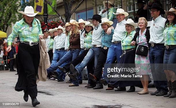 Revelers square dance during the Calgary Stampede on July 11, 2011 in Calgary, Alberta, Canada. The ten day event, drawing over one million visitors,...