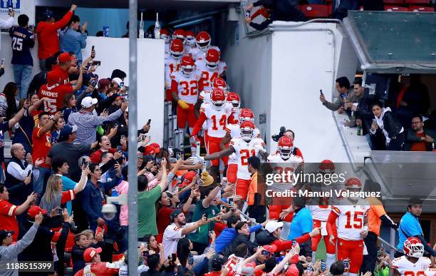 Quarterback Patrick Mahomes of the Kansas City Chiefs and team walk on to the field for warm-ups before the game against the Los Angeles Chargers at...