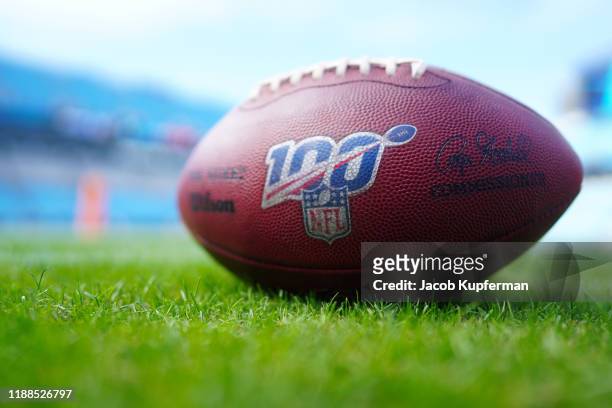An NFL football with the Play 100 logo before the game between the Carolina Panthers and the Atlanta Falcons at Bank of America Stadium on November...