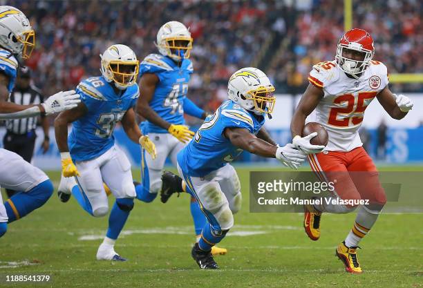 Running back LeSean McCoy of the Kansas City Chiefs carries the ball against the defense of the Los Angeles Chargers during the game at Estadio...