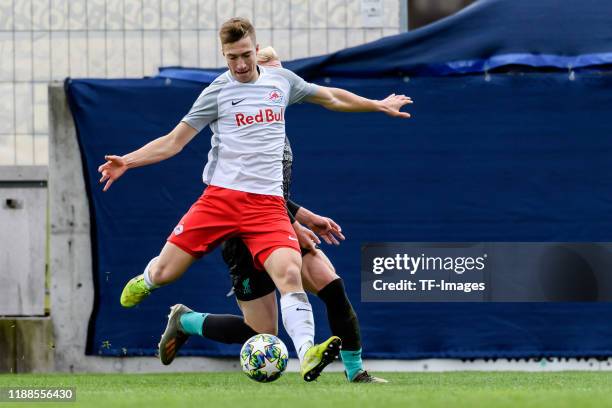 David Affengruber of RB Salzburg and Luis Longstaff of FC Liverpool battle for the ball during the UEFA Youth League match between RB Salzburg U19...