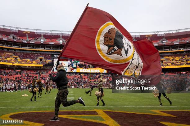General view of a Washington Redskins flag and cheerleaders during the second half of the game between the Washington Redskins and the New York Jets...
