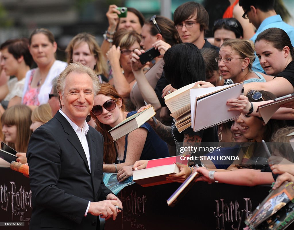 Alan Rickman signs autographs as he arri