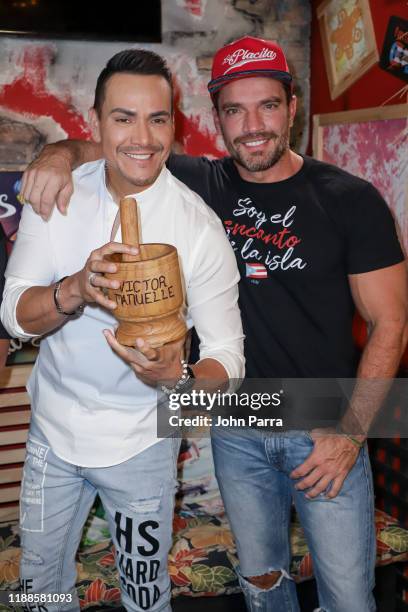 Victor Manuel and Julian Gil pose for a portrait during the release of his new album "Memorias de Navidad" at La Placita on November 18, 2019 in...