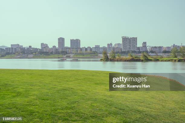 urban landscape of nanchong, sichuan, china - river bank stock pictures, royalty-free photos & images