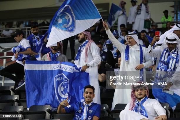Al Hilal fans waving flags and holding banners with the clubs crest on during the FIFA Club World Cup 2nd round match between Al Hilal and Esperance...