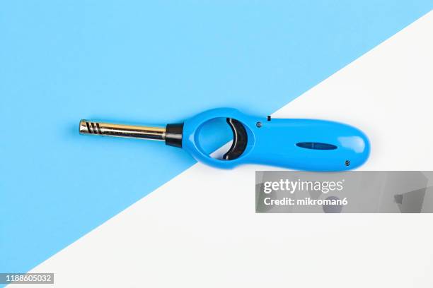 blue kitchen gas lighter gun - flint stock pictures, royalty-free photos & images