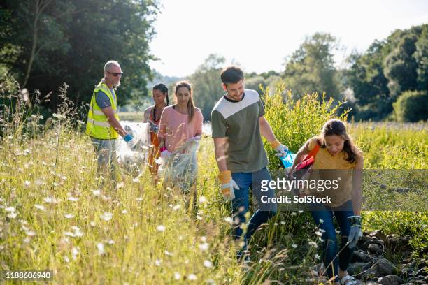 cleaning up the environment - ecologist stock pictures, royalty-free photos & images