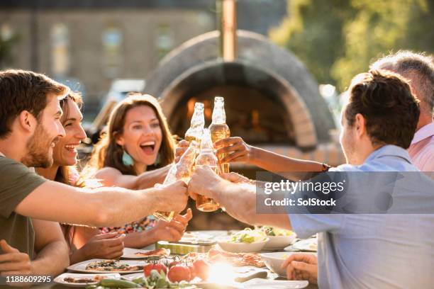 cheers to friendship - patio restaurant stock pictures, royalty-free photos & images