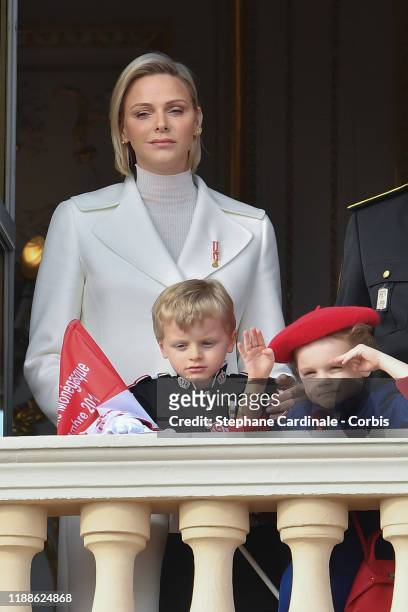 Princess Charlene of Monaco with children Prince Jacques of Monaco and Princess Gabriella of Monaco pose at the Palace balcony during the Monaco...