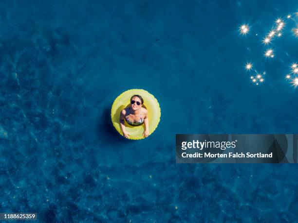 aerial view of a woman enjoying summer in oslo, norway - aerial people circle stock pictures, royalty-free photos & images