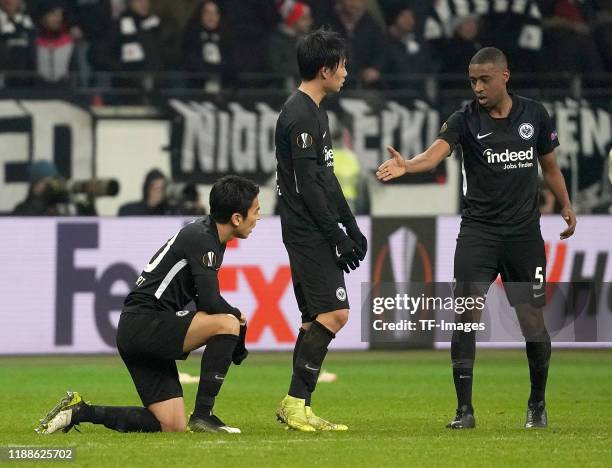 Makoto Hasebe of Eintracht Frankfurt and Daichi Kamada of Eintracht Frankfurt and Gelson Fernandes of Eintracht Frankfurt looks dejected during the...