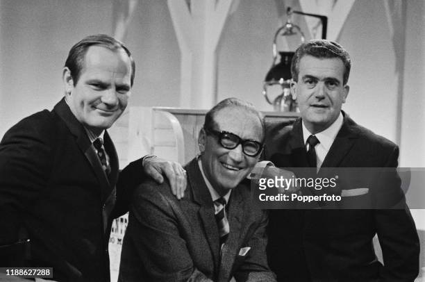 British comedy writers Dick Hills and Sid Green posed with English comedian Arthur Askey on the set of the ABC Television series 'Those Two Fellers'...