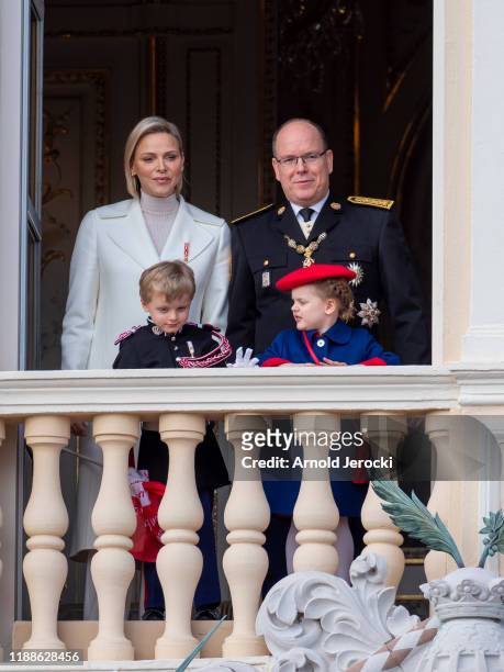 Prince Albert II of Monaco, Princess Charlene of Monaco, Prince Jacques and Princess Gabriela stand at the Palace balcony during the Monaco National...