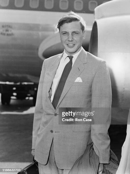 David Attenborough, presenter of the BBC's 'Zoo Quest' nature documentaries, at London Airport before a flight to the South Pacific, 8th September...