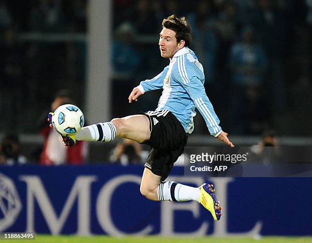 Argentine forward Lionel Messi jumps to kick the ball during a 2011 Copa America Group A first round football match against Costa Rica held at the...