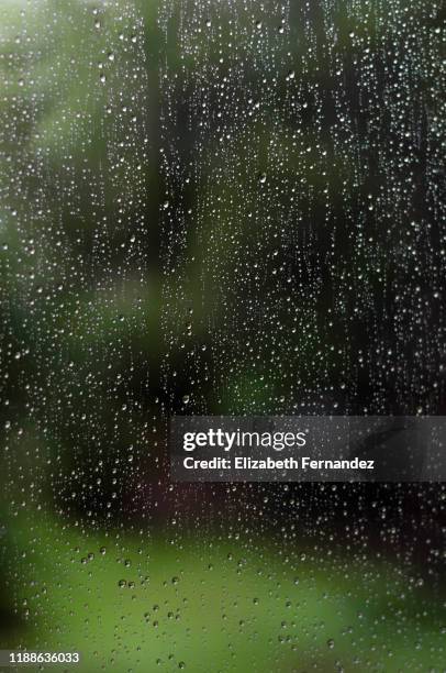 rainy day, wet window water drops background - raindrop stock pictures, royalty-free photos & images
