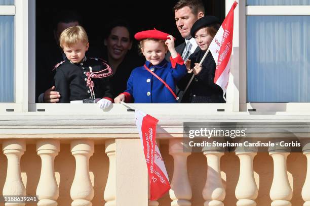 Prince Jacques of Monaco and Princess Gabriella of Monaco and Kaia-Rose Wittstock pose at the Palace balcony during the Monaco National Day...