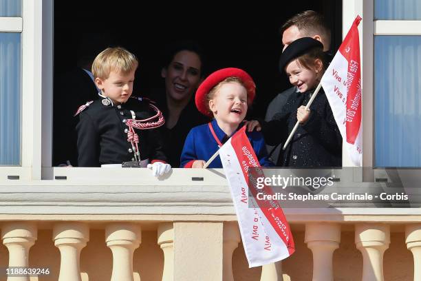 Prince Jacques of Monaco and Princess Gabriella of Monaco and Kaia-Rose Wittstock pose at the Palace balcony during the Monaco National Day...