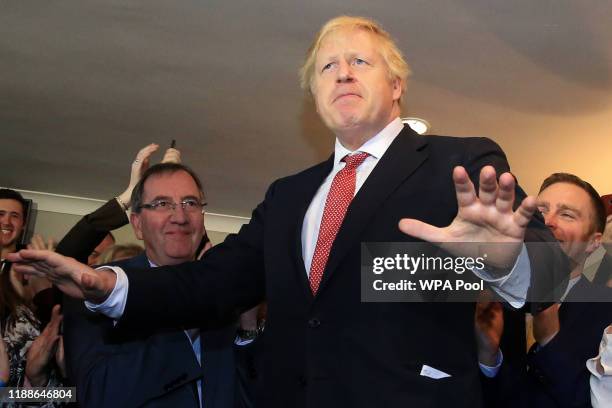 Prime Minister Boris Johnson gestures as he speaks to supporters on a visit to meet newly elected Conservative party MP for Sedgefield, Paul Howell...