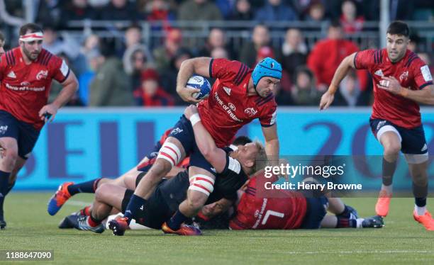 Tadhg Beirne of Munster injures his left ankle as he is tackled by Vincent Koch of Saracens during the Heineken Champions Cup Round 4 match between...