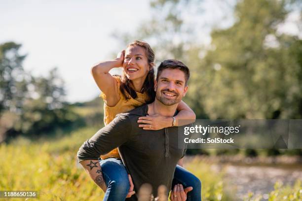 Couple Back Ride Piggy Back Ride Couple Photos and Premium High Res Pictures - Getty Images